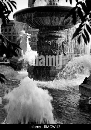 The Wittelsbacher Brunnen (fountain) at the Lenbachplatz in Munich. On the left-hand side a man on a horse. Stock Photo