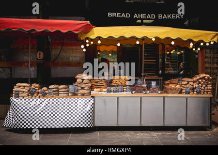 London, UK - June, 2018. Organic bread and pastries on display at a bakery stall in Borough Market, one of the biggest food market in London. Stock Photo