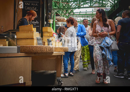 London, UK - June, 2018. Swiss Gruyere cheese on sale at a stall in Borough Market, one of the oldest and largest food market in London. Stock Photo