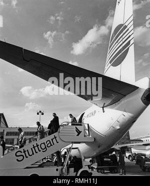 Passengers leave a Boeing 737 of the airline Euroberlin (tail number G-MONP) on the apron of the Stuttgart airport. Stock Photo