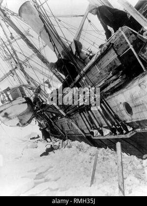 Sir Ernest Shackleton on board shackletons ship the Endurance stuck in ice formation in Antarctica  Photo taken 1916 Stock Photo