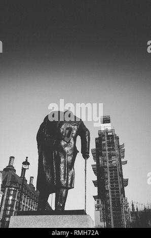 Juxtapostion of Big Ben facing Winston Churchill statue, London UK - grain added deliberately for effect. Stock Photo
