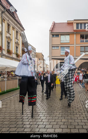 Jawor, Poland - August 2018 : Street circus performers walking on stilts during parade on the annual Bread and Gingerbread Festival Stock Photo