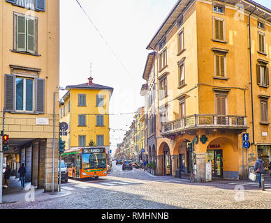 A Urban Bus crossing Via Giovanni Battista Moroni at Citta Bassa, Bergamo, Lombardy, Italy. View from Via Zambonate street. Stock Photo