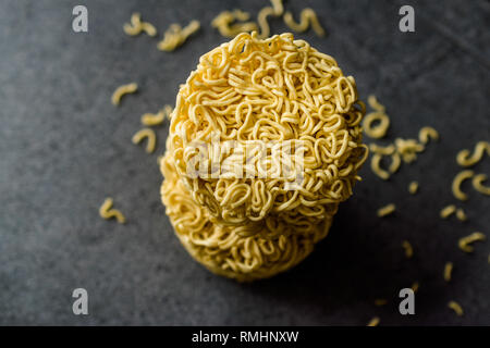 Raw Instant Noodles on Grey Surface. Organic Traditional Food. Stock Photo