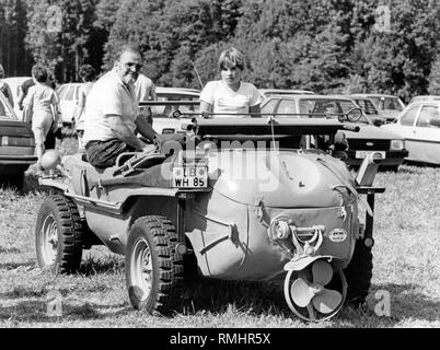 Klaus Rauser in the restored Volkswagen Type 166 Schwimmwagen. Rauser and his daughter Sylke drove the car from Fresberg am Neckar to Reit im Winkl in 1984. Stock Photo