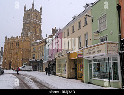 Winter snow in the market place, Cirencester town centre, Gloucestershire Cotswolds, South West England, UK