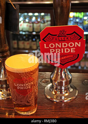 Fullers London Pride hand pump on a bar / pub, North West England, Best bitter, CAMRA ale alcoholic beverage, brewed in Chiswick, West London Stock Photo