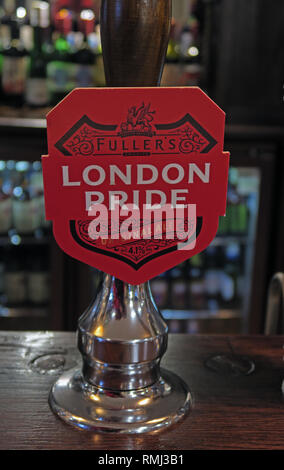 Fullers London Pride hand pump on a bar / pub, North West England, Best bitter, CAMRA ale alcoholic beverage, brewed in Chiswick, West London Stock Photo