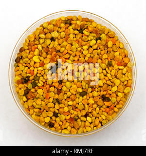 Colourful organic bee pollen grains in jar Stock Photo