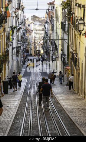 LISBON, PORTUGAL - September 08, 2016: Street view with famous old tourist tram full of people during the sunny day in Lisbon city, Portugal Stock Photo