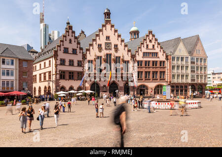 Frankfurt - Germany, Roemerberg, May 26th 2018, people walking on Frankfurt historic townhall square Roemerberg in front of the Roemer on a sunny spri Stock Photo