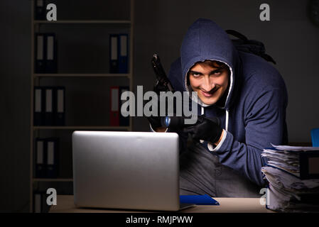Thief trying to steal personal data in identity theft concept Stock Photo