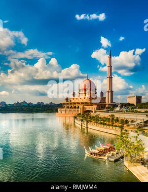 Putrajaya skyline. Boats on the foreground. Amazing view of  Putra mosque at sunset Stock Photo
