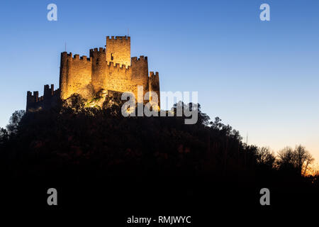 Almourol, Portugal - January 12, 2019: Almourol castle at dusk and illuminated by artificial light. Stock Photo