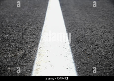 Asphalt road texture with white reflecting line. New road, surface a new asphalt highway Stock Photo