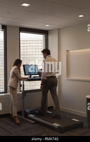 People discussing over documents in the office Stock Photo