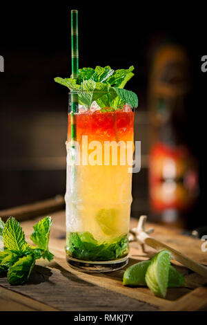 https://l450v.alamy.com/450v/rmkj7y/rum-and-green-chartreuse-tiki-cocktail-served-in-a-bamboo-glass-with-fresh-mint-rmkj7y.jpg