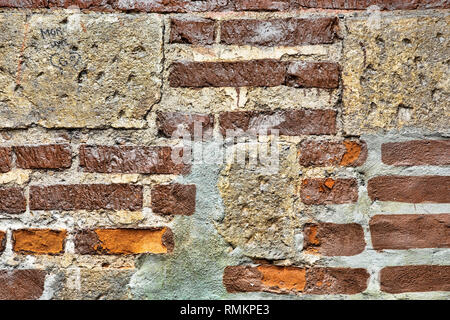 Old brick wall from the construction of an ancient building Stock Photo