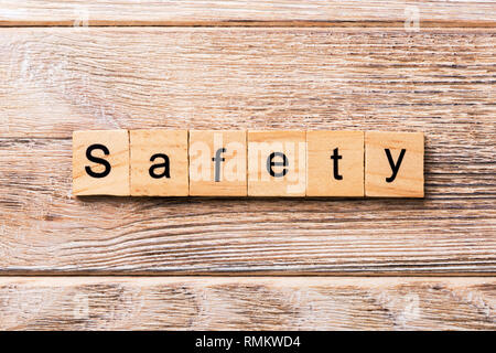 safety word written on wood block. safety text on wooden table for your desing, concept. Stock Photo