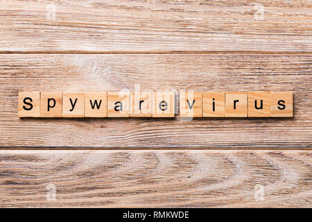 Spyware virus word written on wood block. Spyware virus text on wooden table for your desing, concept. Stock Photo