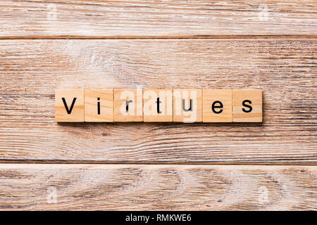 virtues word written on wood block. virtues text on wooden table for your desing, concept. Stock Photo