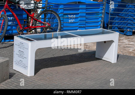 Solar smartphone charging bench. Photographed in Jaffa, Israel Stock Photo