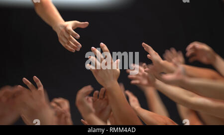 helping hand extended to other people Stock Photo