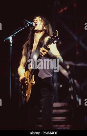 Ac/Dc guitarist Malcom Young is shown performing on stage during a 'live' concert appearance. Stock Photo