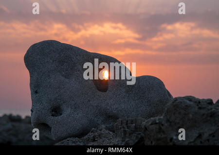Hole in the stone, sunset sunrise Stock Photo