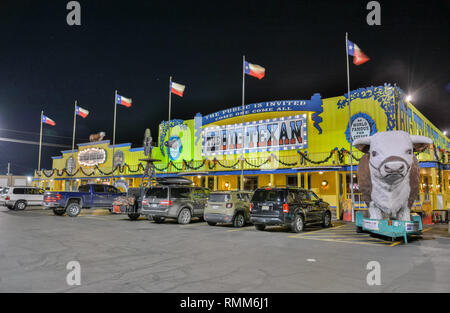 Amarillo, Texas, United States of America - January 1, 2017. Exterior view of Big Texan Steak Ranch in Amarillo, TX, at night, with cars. Stock Photo