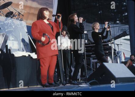 The vocal group Wilson Phillips, consisting of Carnie and Wendy Wilson and Chynna Phillips, is shown performing on stage during a 'live' concert appearance. Stock Photo