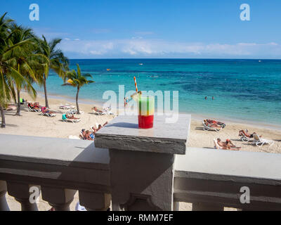 Ocho Rios Jamaica - 5 February 2019: Cocktail overlooking Caribbean Beach Stock Photo