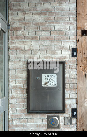 Security drop box in brick wall Stock Photo