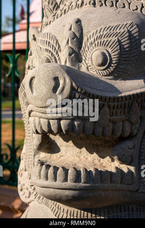 Cambodia, Phnom Penh, City Centre, Street 19, traditional carved stone lion uarding entrance to Veal Preah Man square Stock Photo