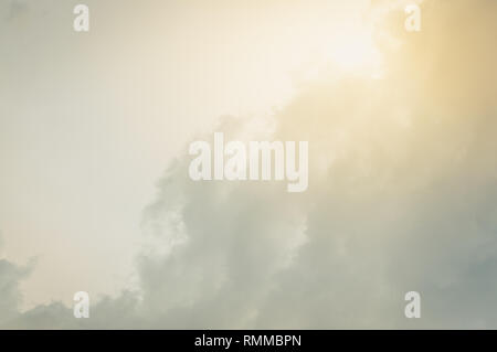 Sky background with clouds and sun grow. Toned. Stock Photo