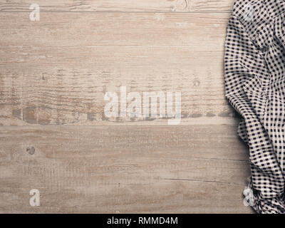 Checkered table cloth on a wooden kitchen table with copy space Stock Photo
