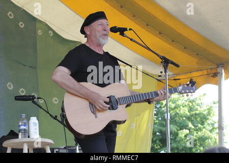 Singer, songwriter and guitarist Richard Thompson is shown performing on stage during 'live' concert appearance. Stock Photo