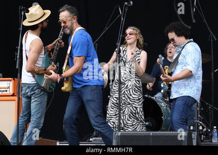 Trigger Hippy are shown jamming together on stage during a 'live' concert appearance. Stock Photo