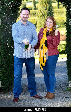 Andrew Symes and Natalie Metcalf, from Bristol, celebrate their £1 million win on the EuroMillions UK Millionaire Maker, at the De Vere Tortworth Court Hotel in Wotton-under-Edge, Gloucestershire. Stock Photo