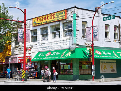 Vancouver, B.C., Canada - July 18, 2012: Detail view of a corner house with a chinese store at Main Street in Chinatown Stock Photo