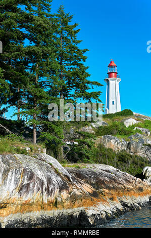 West Vancouver, B.C., Vancouver - June 25, 2012: View at Point Arkinson Lighthouse, reached by hiking the Valley trail in Lighthouse Park Stock Photo