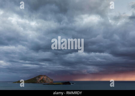 A view of Rabbit island from Makapu'u lookout on a stormy day. Stock Photo