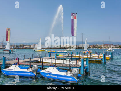 Switzerland, Lake Geneva, pedal boat hire at the Les Eaux-Vives waterfront with view of the Jet d'Eau fountain Stock Photo