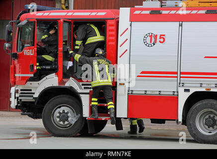 Rome, RM, Italy - May 10, 2018:  fire truck and talian firefighters with uniform during fire drill. 115 is the phone number of italian firemen Stock Photo