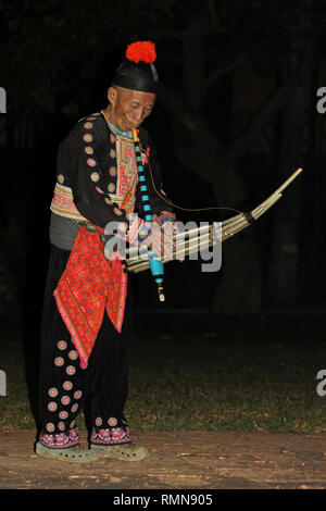 Hmong Tribesman playing the Lusheng (a.k.a Lu Sheng, Qeej, Ghengx) Stock Photo