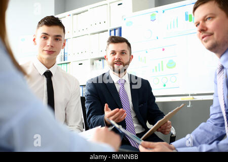 Young handsome teacher man in suit with Stock Photo