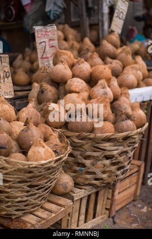 group of coconuts with price boards in a local street market place of Philippines Stock Photo