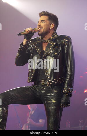 Singer Adam Lambert of the rock band Queen is shown performing on stage during a 'live' concert appearance. Stock Photo