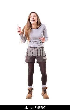 Funny cute expressive woman snapping fingers and winking having idea and looking up. Full body isolated on white background. Stock Photo